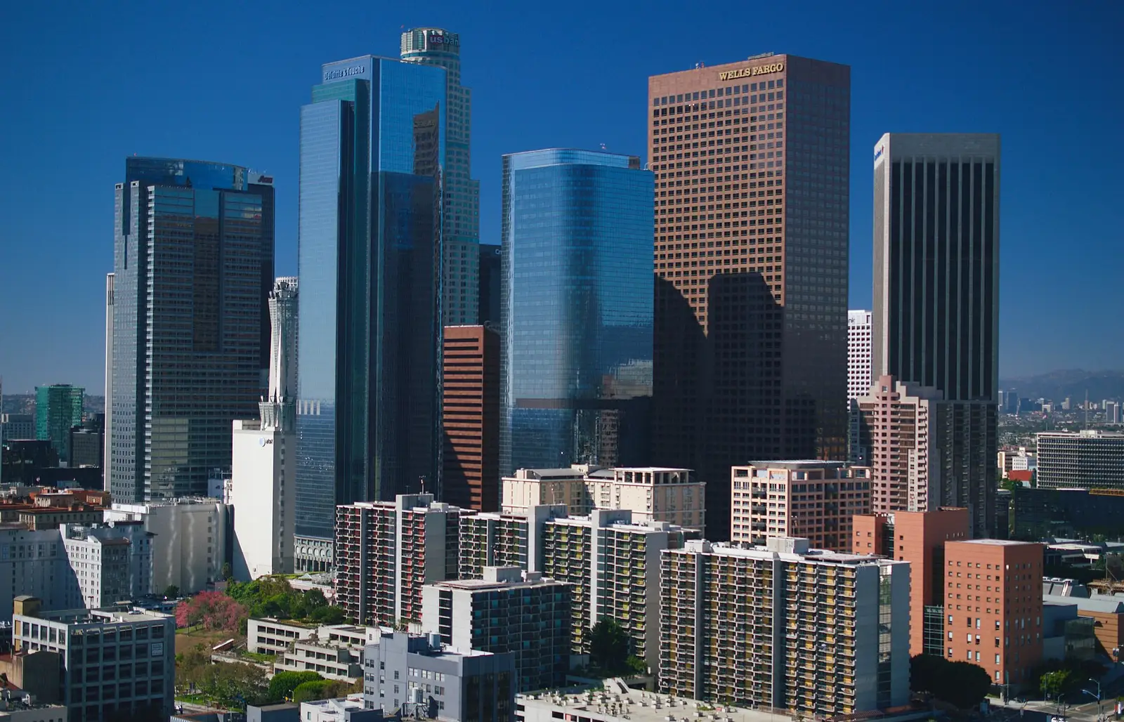 The Downtown Los Angeles skyline with iconic skyscrapers under a clear blue sky, California