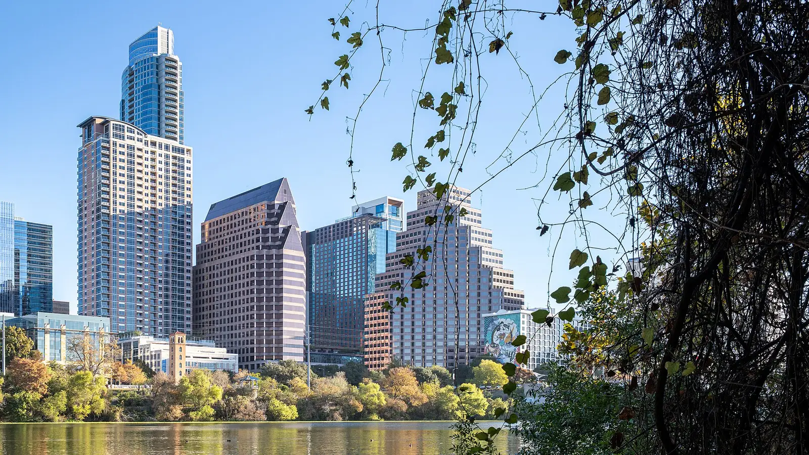 Downtown Austin skyline reflected in Lady Bird Lake under morning light, Texas