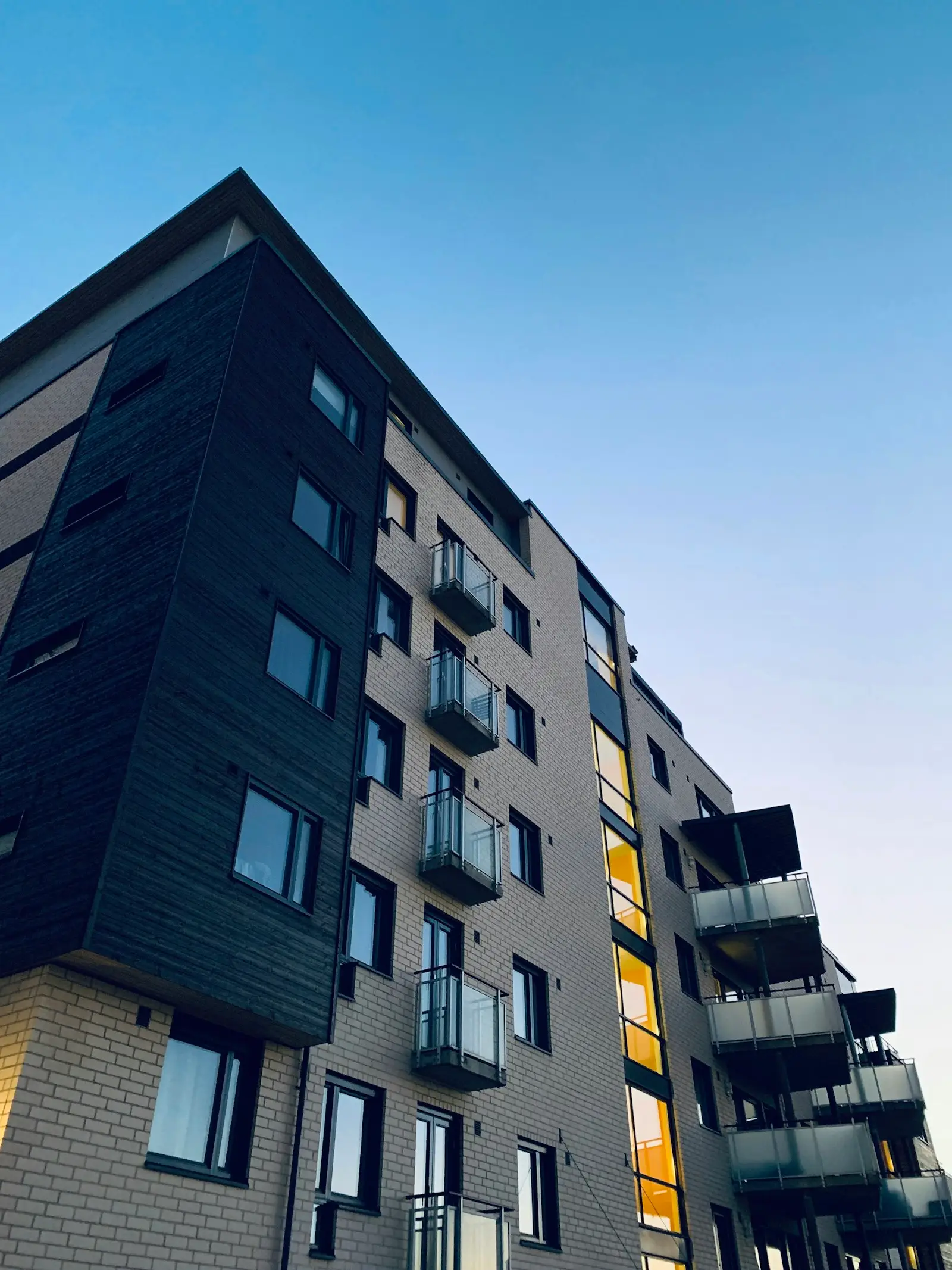 Modern condominium building at dusk